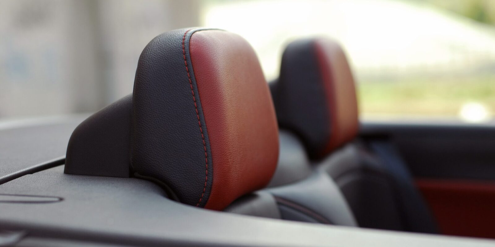 Was ist die Hauptfunktion der Kopfstütze im PKW