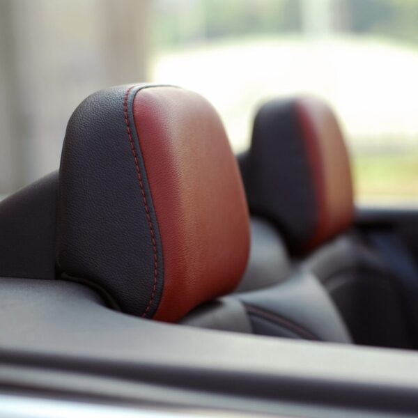 Was ist die Hauptfunktion der Kopfstütze im PKW